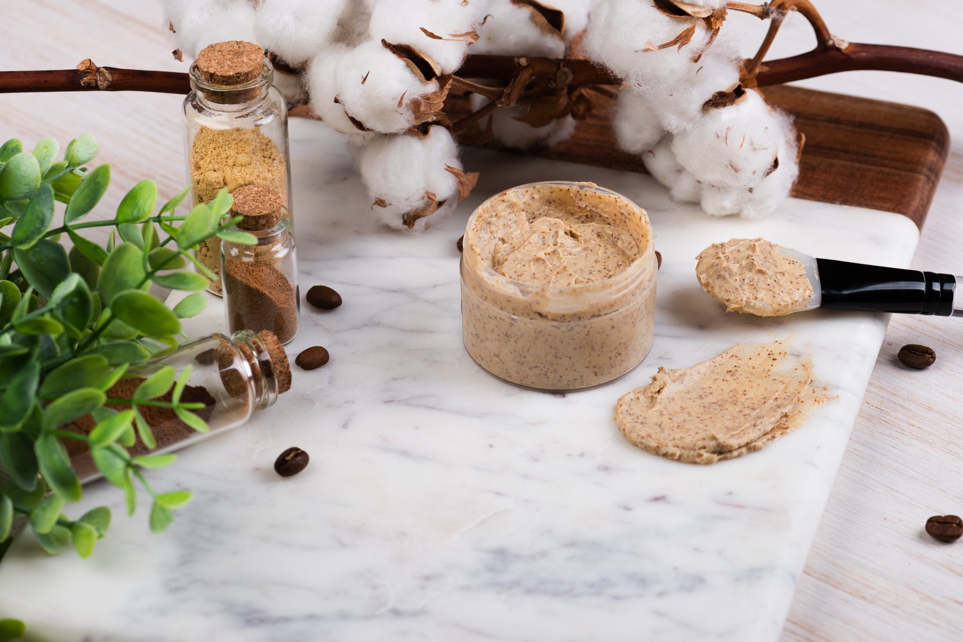 Natural body coffee scrub on marble background